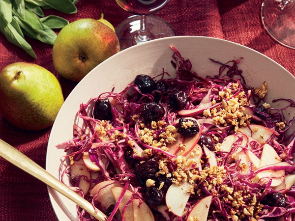 Red cabbage salad with baked cherries, apples, and almond dukkah
