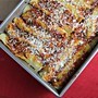 Red chile enchiladas with chicken and melted cheese