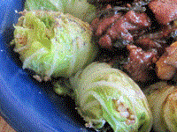 Red-cooked lamb with cabbage rice rolls (Càibāo yánggāoròu / 菜包羊羔肉)