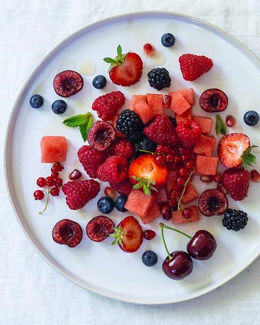 Red fruit salad with maple ginger dressing