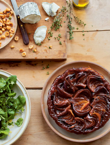 Red onion tarte Tatin with goat's cheese, watercress & hazelnuts