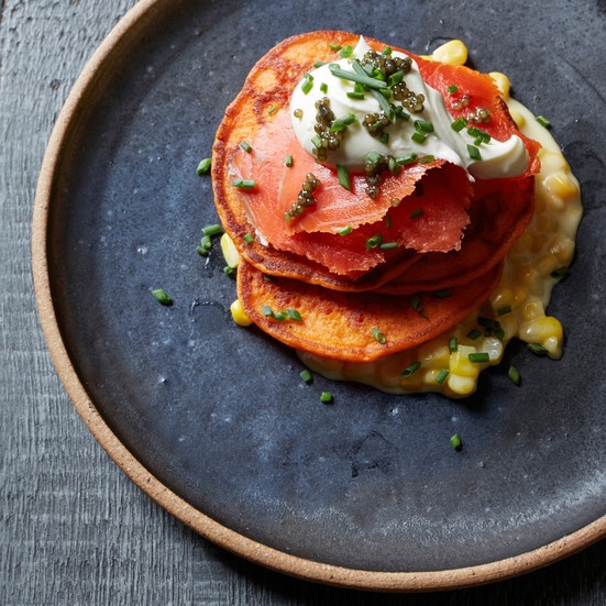 Red pepper blini with creamed corn and smoked salmon