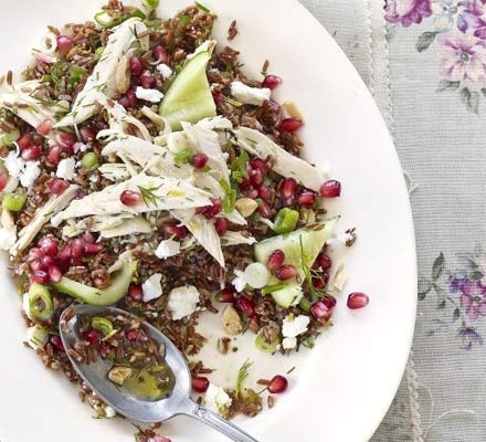 Red rice and chicken salad with pomegranate and feta