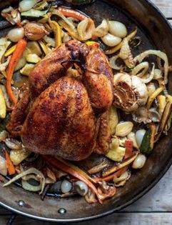 Red roast chicken with lemon, whole garlic & vegetables