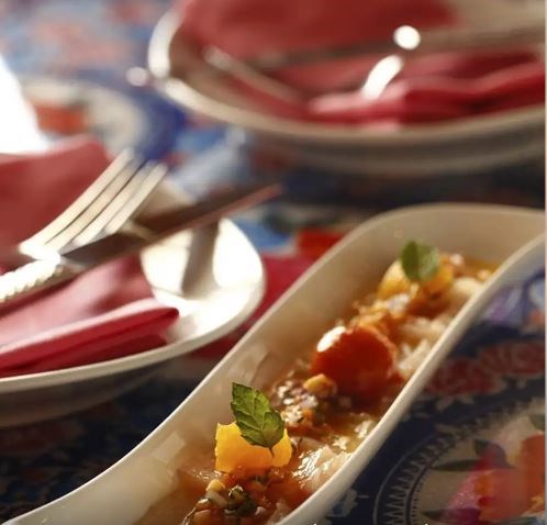 Red snapper a la Veracruzana with mini tostadas and avocado pearls