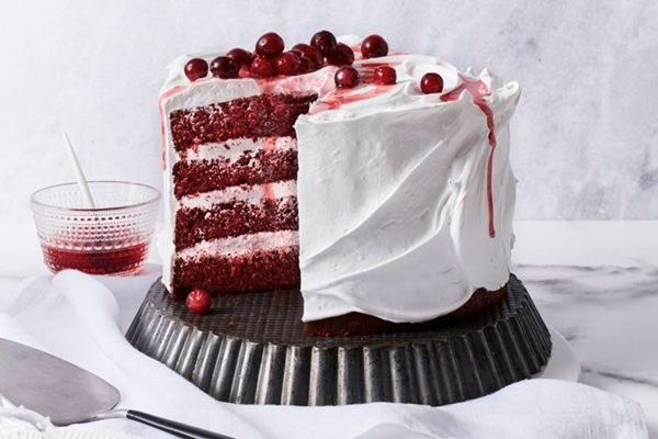 Red velvet and cranberry cake with meringue frosting