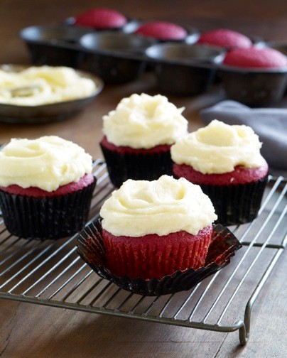Red velvet cupcakes with orange buttercream