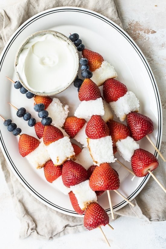 Red white and blue fruit skewers with cheesecake yogurt dip