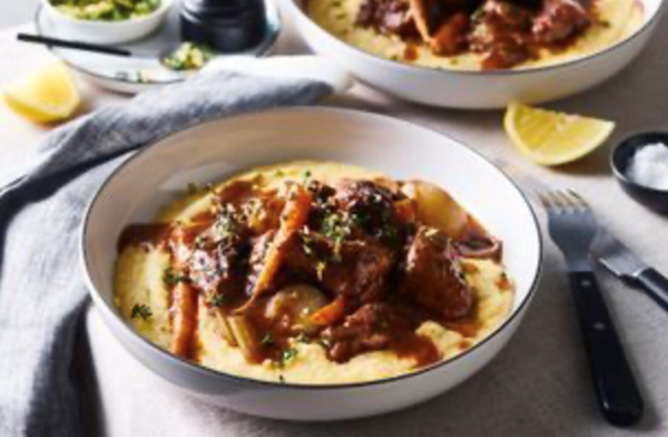 Red wine-braised pork jowl with soft polenta and root vegetables