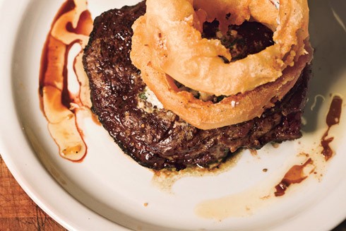 Rib-eye steak with blue cheese butter and Walla Walla onion rings