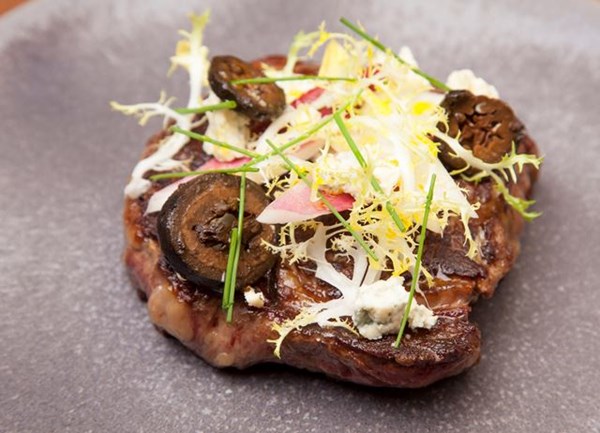 Rib-eye steak with chicory, blue cheese and pickled walnuts