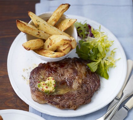 Rib-eye steaks with chilli butter and homemade chips