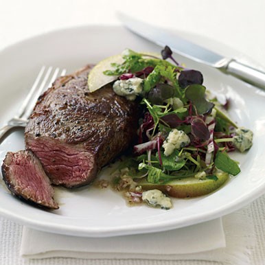 Rib-eye steaks with radicchio, pear, and blue cheese salad