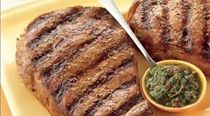 Rib-eye steaks with tomato-chimichurri sauce