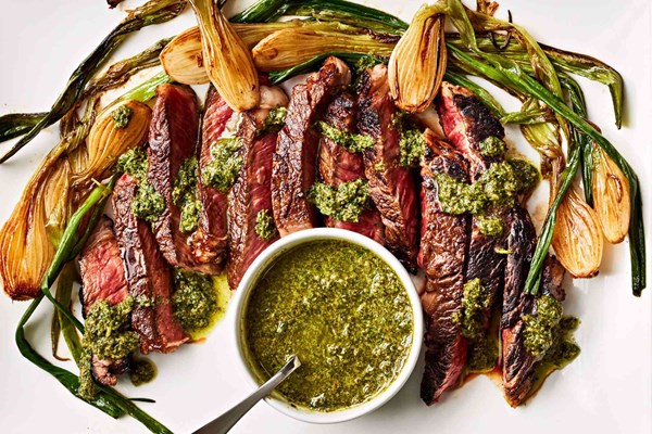 Rib eye with charred spring onions and salsa verde