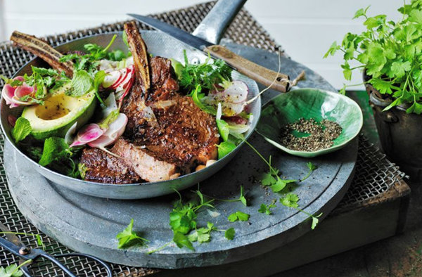 Rib-eye with tomato pesto butter and herb salad