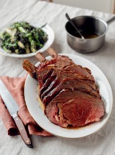 Rib of beef with spring veg and anchovy butter