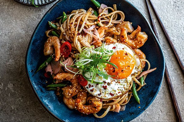 Rice noodles with prawns, dark soy sauce & sesame fried egg