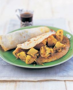 Rice pancakes filled with spiced potatoes