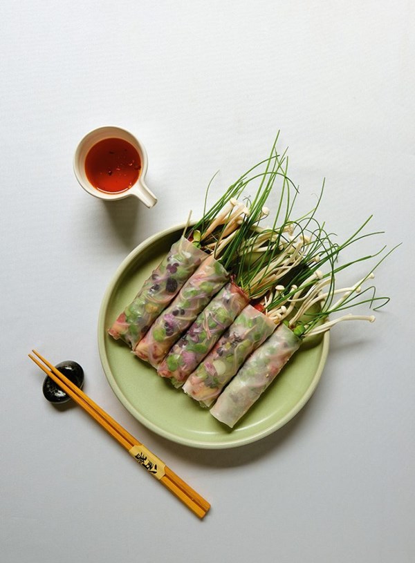 Rice paper rolls with beef and mushrooms and spicy peanut oil