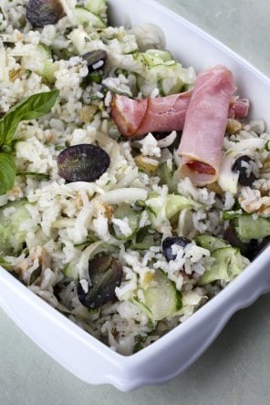 Rice salad with cucumber and grapes in aromatic oil