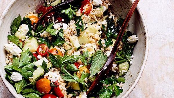 Rice salad with tomatoes, cucumbers, and feta