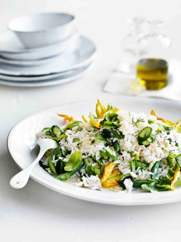 Rice salad with zucchini flowers, peas, beans and mint
