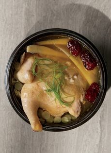 Rice-stuffed Cornish game hen in soup (Samgae tang)