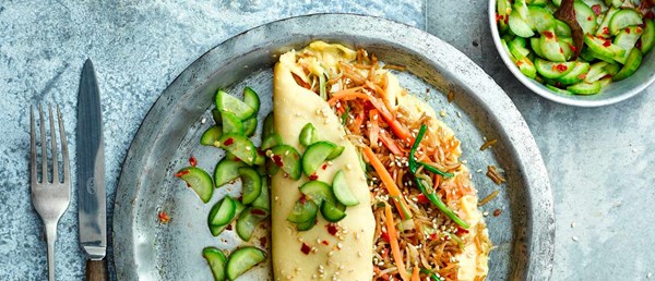 Rice-stuffed omelette with pickled cucumber