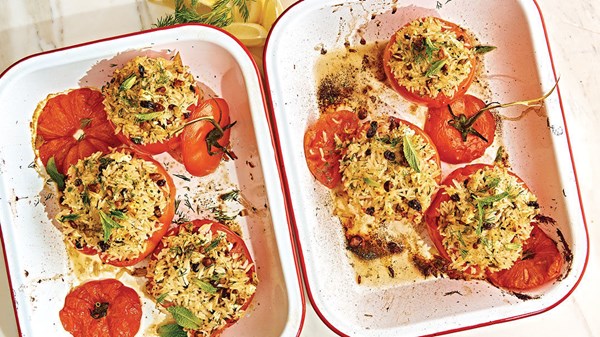 Rice-stuffed tomatoes with pistachios, currants, herbs, feta, and tomato vinaigrette