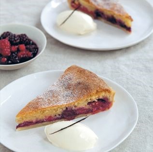Rich almond tart with red berry compote