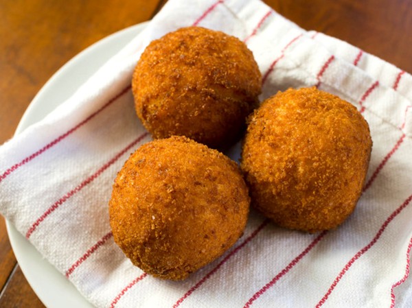 Rich and creamy saffron arancini with mozzarella