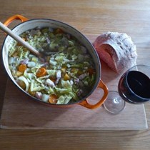 Rich soup with vegetables and preserved meats (La garbure)