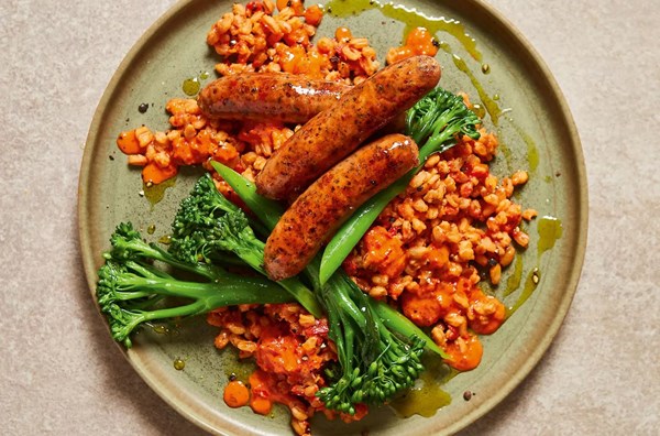 Ricotta & pepper spelt with spicy 'nduja sausages and tenderstem