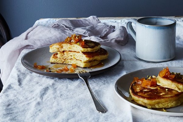 Ricotta and brown butter pancakes with maple-bourbon apricots