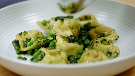 Ricotta and herb cappellacci with pesto, peas and beans
