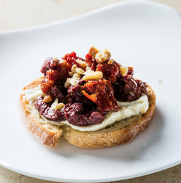 Ricotta crostini with olives and sun-dried tomatoes
