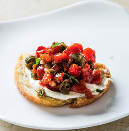 Ricotta crostini with roasted red peppers and capers
