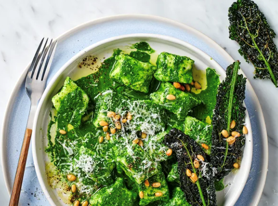 Ricotta gnocchi with cavolo nero and pine nuts
