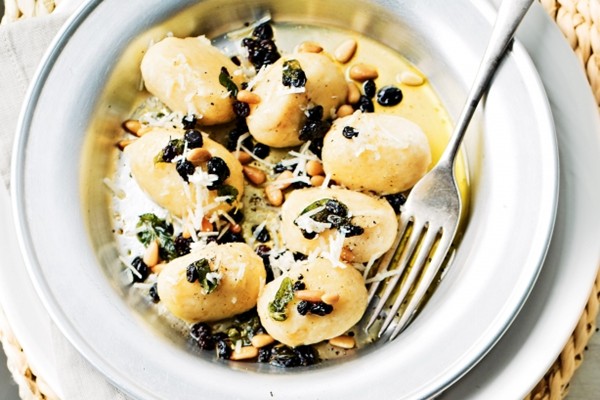 Ricotta gnudi with pine nuts, currants and oregano