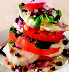 Ripe tomato stack with pine nuts and mozzarella