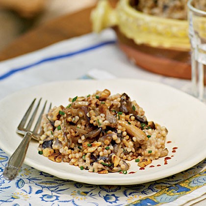 Risotto-style fregula with mushrooms, abbamele, and goat cheese (Fregula kin atunna e crapinu)