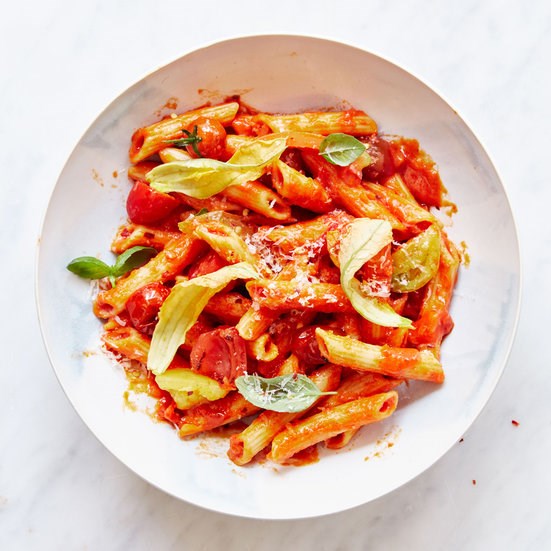 Risotto-style penne with tomatoes and zucchini blossoms