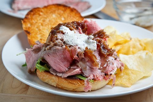 Roast beef sandwich with caramelized onions and grainy mustard, horseradish mayo