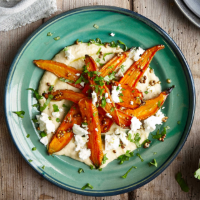 Roast carrots with coriander seeds and feta on chick pea and tahini purée 