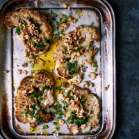 Roast cauliflower steaks with crushed hazelnuts and saffron