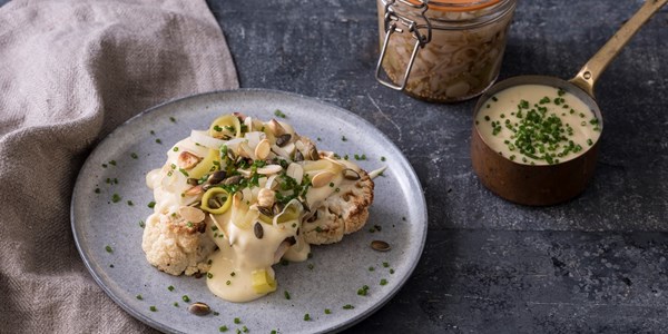 Roast cauliflower with smoked cheddar sauce, pickled leeks, nuts and seeds