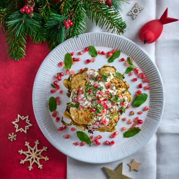 Roast cauliflower with yoghurt and pomegranate dressing