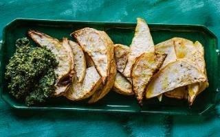 Roast celeriac wedges with kale and walnut pesto