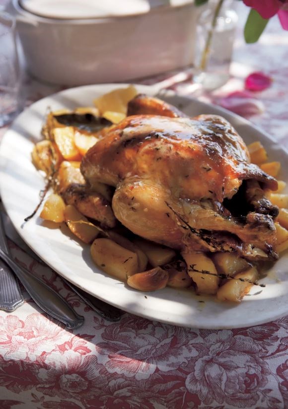 Roast chicken and potatoes with thyme, lemon, and garlic